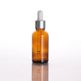 amber glass dropper bottle with silver cap