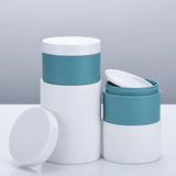 white and blue cream jars