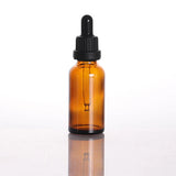 amber glass dropper bottle with black lid